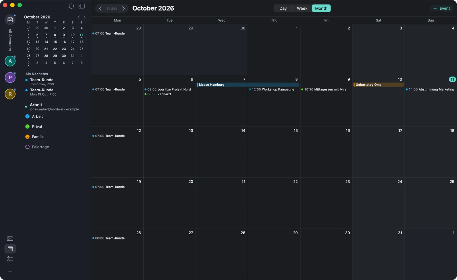 The month view for October 2026 with events as lines in the day cells and the multi-day event “Messe Hamburg” as a bar.